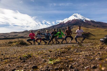 COTOPAXI, ECUADOR, May 2, 2015: Group of tourists having fun dancing on a visit to the National Park Cotopaxiのeditorial素材