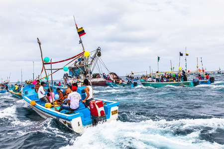 Puerto Lopez, Ecuador - July 31, 2015: The fishermen of the community of Puerto Lopez leave in their boats arranged with ribbons and balloons to participate in the Maritime Procession for the festivities of San Pedro and San Pablo, in the month of June, Eのeditorial素材