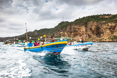 Puerto Lopez, Ecuador - July 31, 2015: The fishermen of the community of Puerto Lopez leave in their boats arranged with ribbons and balloons to participate in the Maritime Procession for the festivities of San Pedro and San Pablo, in the month of June, Eのeditorial素材