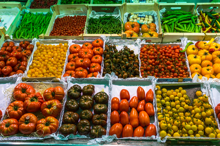 Tomatoes of different variety in the market shelvesのeditorial素材