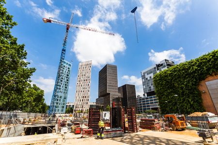 BARCELONA, SPAIN, JUNE 6, 2017: Modern skyscrapers under construction in the 22nd district of Barcelona that has a high urban developmentのeditorial素材