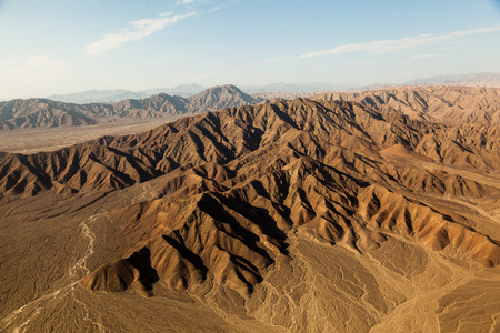 Aerial view of the mountainous desert silhouettes around the city of Nazca, Peruの写真素材
