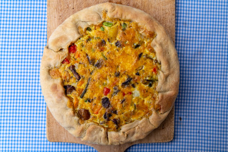 Pascualina cake, made of baked dough, stuffed with vegetables and egg, covered with cheese