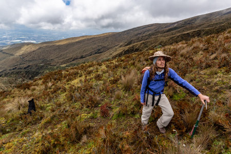 Ilinizas, Machachi, Ecuador, August 30, 2023: a climber takes a break, while the photographer includes him in his landscape, on the slopes of the Los Ilinizas volcano, during his ascent.のeditorial素材