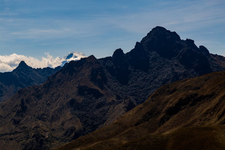 Yanahurco de Mojanda hill and Cayambe volcano behind, against lightの写真素材