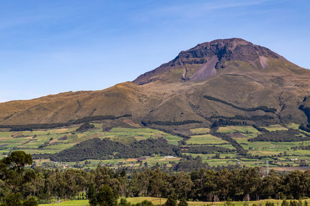 CorazÃ³n Volcano, Andean landscape with its crop fields and mountains showing their greenery on a clear morningの写真素材