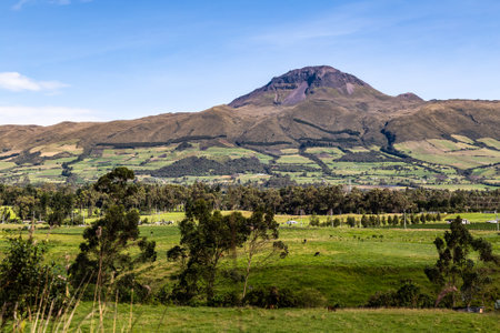 CorazÃ³n Volcano, Andean landscape with its crop fields and mountains showing their greenery on a clear morningの写真素材