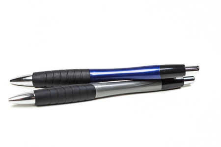 Black and blue writing pens isolated on white background isolated on white backgroundの写真素材