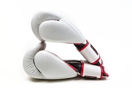 Pair of boxing gloves in a heart shape  isolated on white backgroundの写真素材