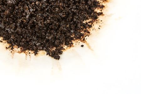 Used coffee grounds isolated on white backgroundの写真素材