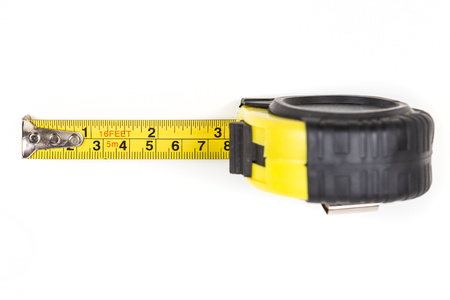 Black and yellow measuring tape isolated on white backgroundの写真素材