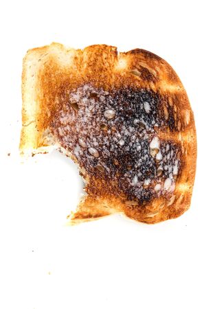 Burned whole grain toast isolated on white backgroundの写真素材