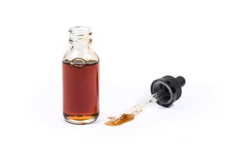 Assorted flavors vape juice and eyedropper being used isolated on white backgroundの写真素材