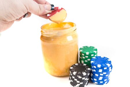 Concept poker chips and dip isolated on a white backgroundの写真素材