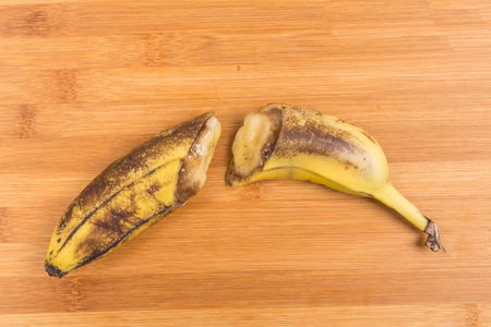 Old beaten cut up banana isolated on white backgroundの写真素材