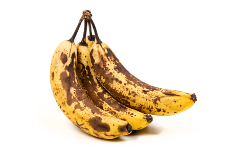 Bunch of overripe bananas isolated on white backgroundの写真素材
