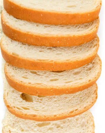 Slices of whole grain bread isolated on white backgroundの写真素材