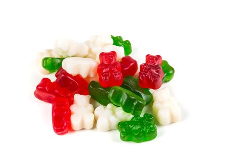 Red white and green gummy bears isolated on a white backgroundの写真素材