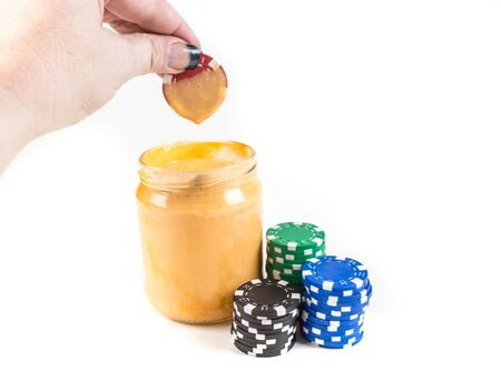 Concept poker chips and dip isolated on a white backgroundの写真素材