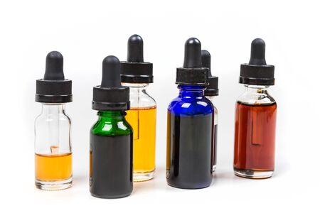 Assorted flavors of vape juice isolated on white backgroundの写真素材