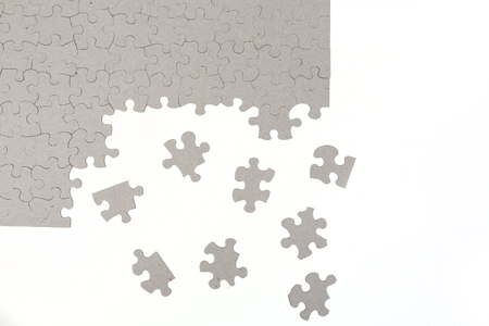 Blank puzzle partially completed isolated on white backgroundの写真素材