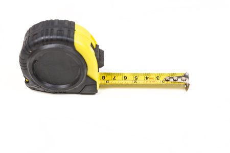 Black and yellow measuring tape isolated on white backgroundの写真素材