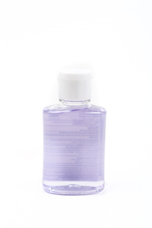 Small container of hand sanitizer isolated on white backgroundの写真素材