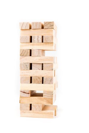 Tower of wooden game pieces isolated on white backgroundの写真素材