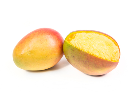 Two ripe mangos isolated on white backgroundの写真素材