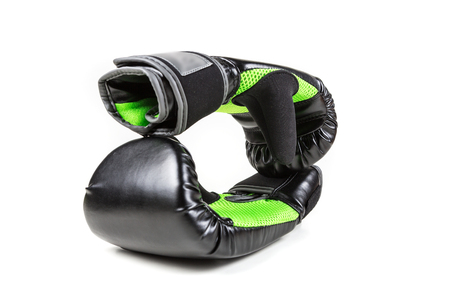 Green and black boxing gloves isolated on white backgroundの写真素材