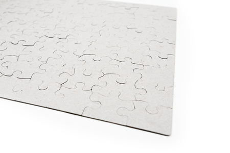 Blank whole puzzle put together isolated on white backgroundの写真素材