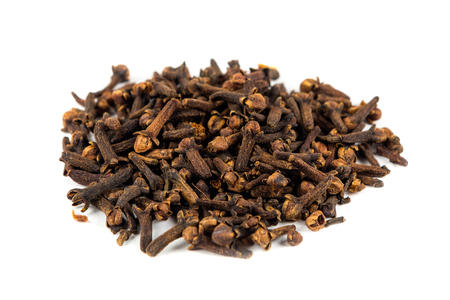 Pile of whole cloves isolated on white backgroundの写真素材