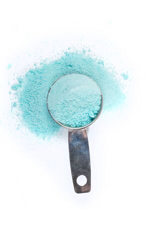 Scoop of laundry detergent isolated on white backgroundの写真素材