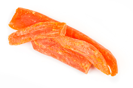 Dried papaya strips isolated on white backgroundの写真素材