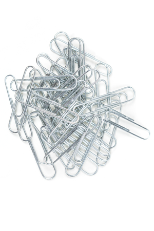 Pile of silver paperclips isolated on white backgroundの写真素材