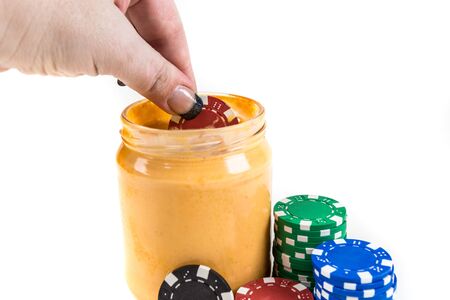 Concept poker chips and dip isolated on a white backgroundの写真素材