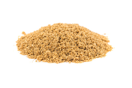 Pile of ground coriander isolated on white backgroundの写真素材