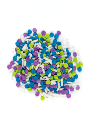 Colorful candy sprinkles isolated on white backgroundの写真素材