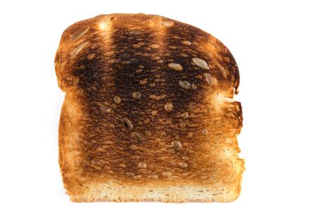 Burned whole grain toast isolated on white backgroundの写真素材
