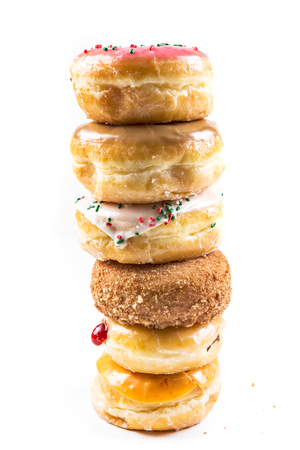 A stack of delicious donuts isolated on a white backgroundの写真素材