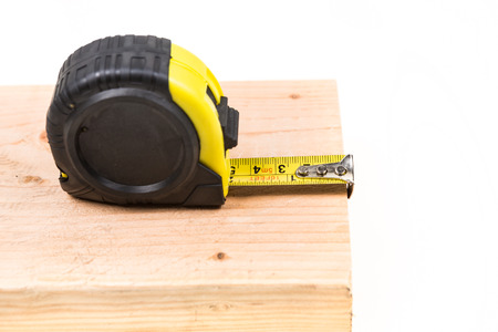 Black and yellow measuring tape isolated on white backgroundの写真素材