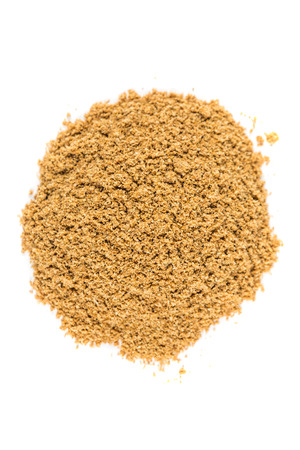 Pile of ground coriander isolated on white backgroundの写真素材