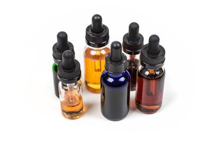 Assorted flavors of vape juice isolated on white backgroundの写真素材