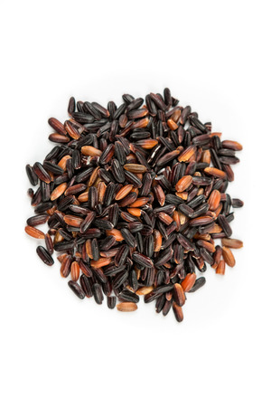 Japonica black rice isolated on white backgroundの写真素材