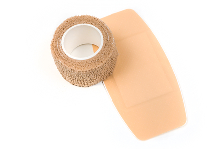 Large sticky bandage and bandage wrap isolated on white backgroundの写真素材