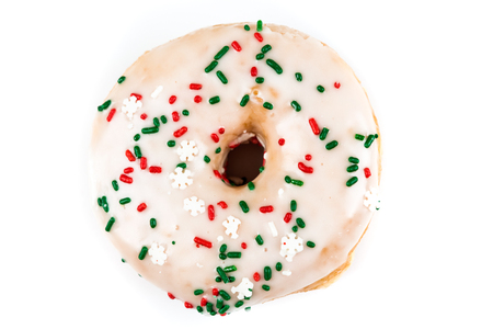 Raised frosted donut isolated on a white backgroundの写真素材