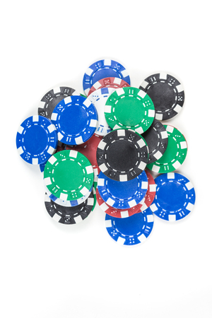 Pile of poker chips isolated on white backgroundの写真素材