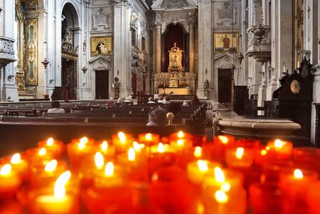 September 14th 2017, Lisbon, Portugal: burning red sacrificial candles in churchの写真素材