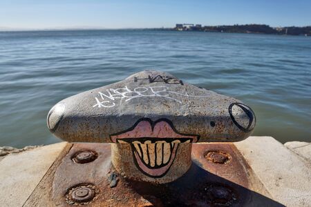 Funny painted sea bollards near Lisbon / Portugalの写真素材
