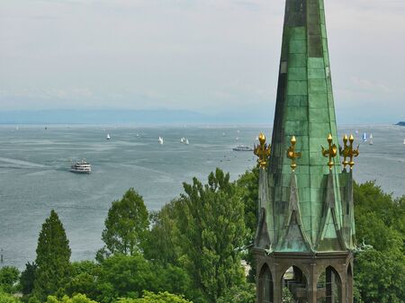 Germany: Church tower Constance Munster with sailors on Lake Constance in the backgroundの写真素材